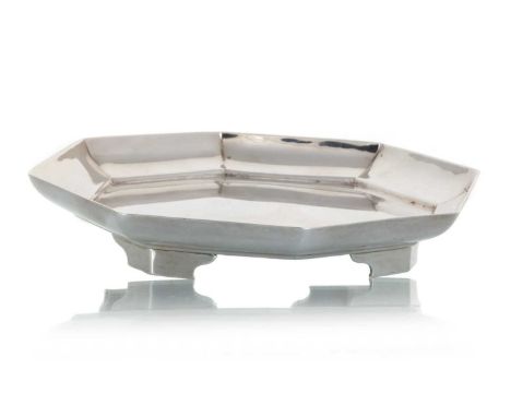 BRITANNIA SILVER TEAPOT STAND, ELKINGTON & CO, LONDON 1914  of octagonal form with raised edge, raised on four bracket feet15