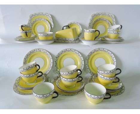 A quantity of Lawleys Foley china yellow ground tea wares with black printed swag detail comprising a pair of cake plates, mi