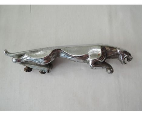 A vintage chrome plated leaping jaguar car bonnet mascot