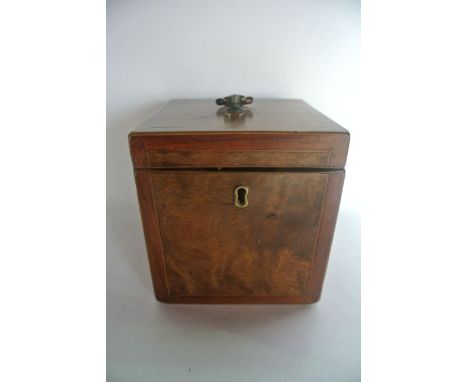 A Regency walnut veneered caddy of cubed form with square mahogany hinged lid and inlaid mahogany borders, the top with flowe