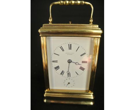 A French brass carriage clock, set in a gorge case with an 8 day striking movement stamped 20690 retailed by Henry Capt - Gen