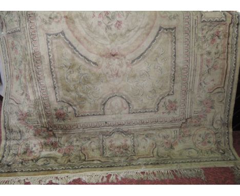 A cotton carpet in the aubosson style with floral detail upon a beige ground 200 x 320