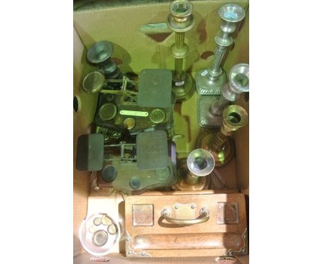 A box containing a selection of mostly brass wares to include two vintage sets of postal scales, both with brass frames set u