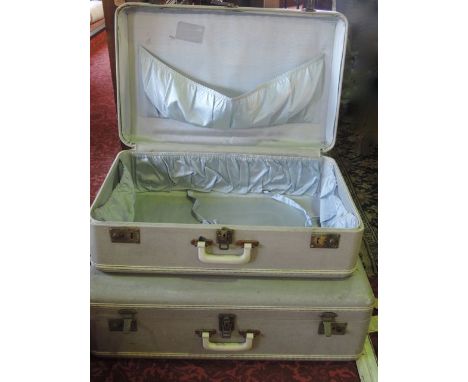 A vintage travelling case with pale blue faux shagreen finish, with cream coloured Bakelite type mounts and handle, with dual