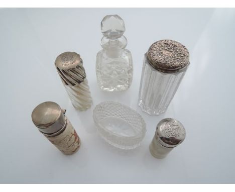 A Victorian silver-mounted scent bottle, London, 1886, the cylindrical twisting glass bottle with silver screw top, conformin