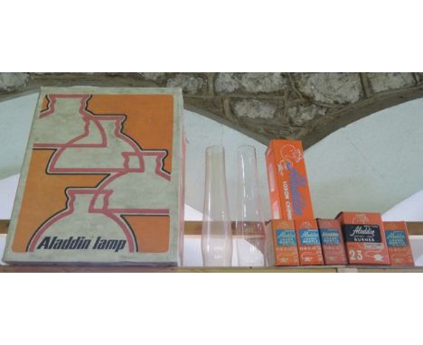 An original vintage Aladdin lamp cardboard box containing a selection of boxed Aladdin effects to include four boxed Loxon ma