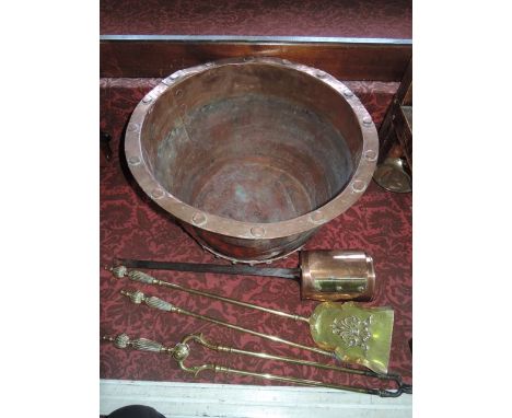 A substantial 19th century log bin of cylindrical form with bolted banded detail to the lower quarter, set beneath a flared r