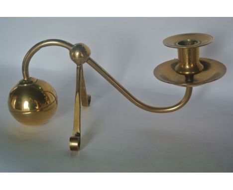 In the manner of W A S Benson a counter weight brass candlestick with an  S shaped bracket terminating in a weighted ball soc