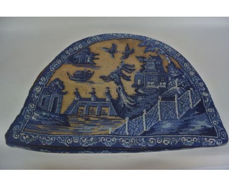 An unusual Victorian bead work panel of oval form with quilted lined backing in various shades of blue and white, set upon a 
