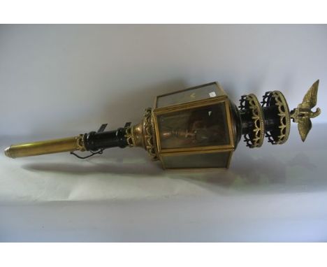A pair of reproduction coach lanterns, converted to electricity for outdoor purposes, each of hexagonal form with bevelled gl