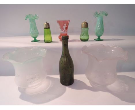 A near pair of Victorian style green glass vases with drawn necks, with textured finish and further Vaseline tinted detail, w