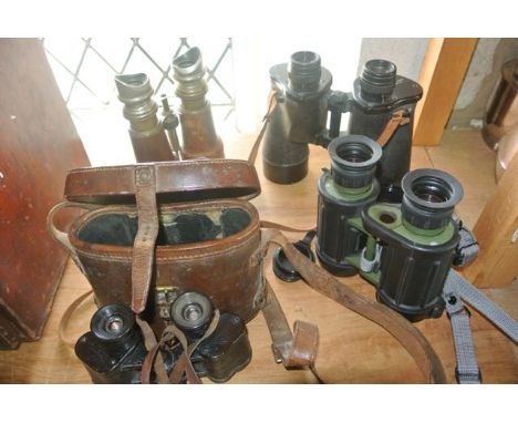 A selection of binoculars to include a good quality vintage 20th century pair with tan leather clad telescopic brass lenses w