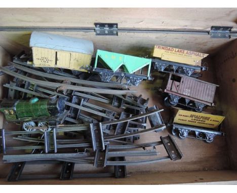 A vintage pine chest with hinged top containing a selection of good quality 20th century 0 gauge model railway effects to inc