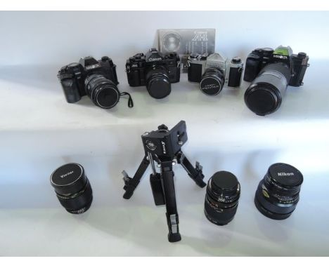 A selection of vintage cameras and photography equipment to include two Minolta 9000 AF cameras, each fitted with telescopic 