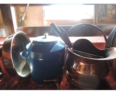 A vintage ironwork water vessel of cylindrical form flanked by two applied loop handles with a circular lid with brass finial
