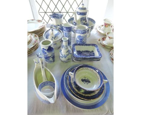 A quantity of 19th century and other blue and white wares including an oriental bottle shaped vase with six character mark to