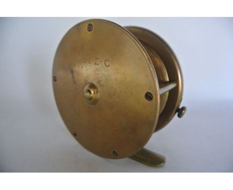A good quality early 20th century Army & Navy brass fishing reel with composite thimble shaped handle, stamped A & N CSL Make