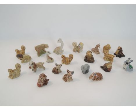 A quantity of Wade Whimsies including a model of a seated giraffe, Disney characters from Lady and the Tramp, etc