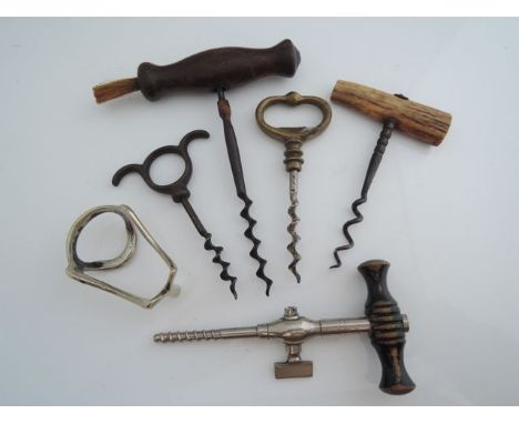 5 various vintage corkscrews including a champagne cork tap.