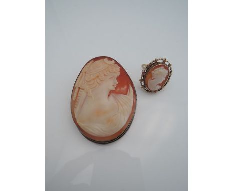 A 20th century cameo brooch, the shell carved with the profile of a lady, mounted in a silver frame, 800 standard; and a came
