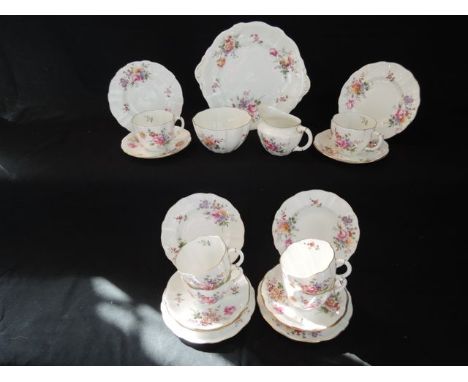 A six place Royal Crown Derby Derby Posies pattern tea service comprising milk jug, sugar bowl, cake plate, six cups, six sau