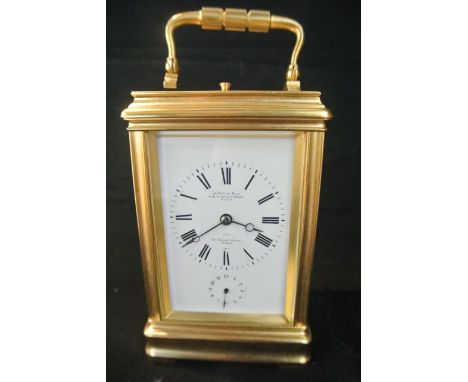 A French brass carriage clock set in a gorge case with 8 day striking movement with alarm and repeat action by Le Roy & Fils 