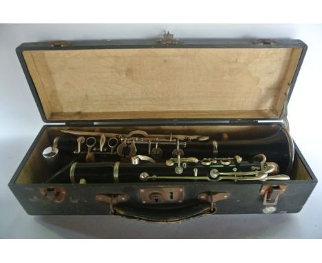A vintage cased Chinese clarinet, the mouthpiece marked indistinctly Boosey & Hawkes Ltd, London, BN2, the main body indistin