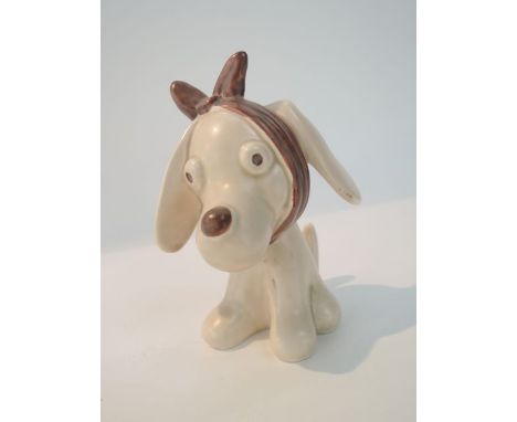 A Sylvac model of a cream glazed humorous doleful puppy with brown bandage around his head, with printed and impressed marks 
