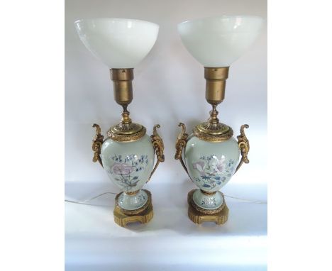 A good quality pair of ceramic table lamps, believed to be American,  of baluster vase form with painted decoration of a flor