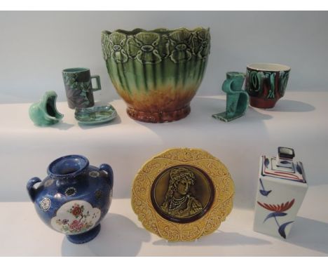 A collection of ceramics including an early 20th century jardinière with mottled green glaze and moulded floral border, a maj