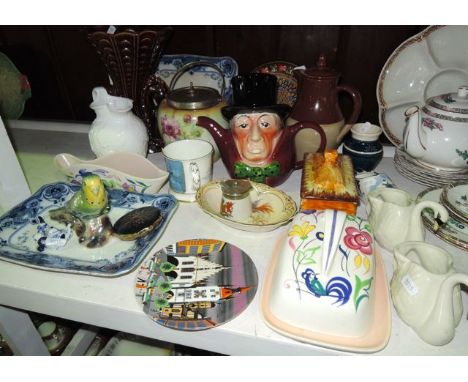 A collection of ceramics including a Poole Pottery cheese dish and cover with painted floral and bird decoration, a matching 