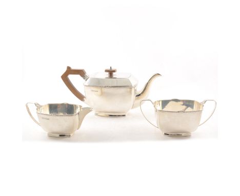 Silver three piece teaset, by Stower &amp; Wragg Ltd, Sheffield 1964, the teapot with composition handle and finial, 14cm, 35