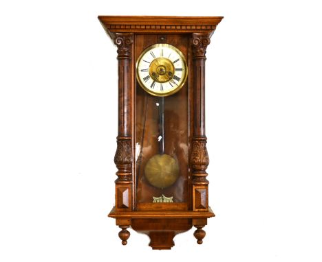 A Vienna stained beechwood wall clock, gilt dial with ivorine chapter ring, spring-driven movement, door flanked by pilaster 