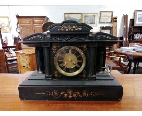 A Victorian black slate mantel clock, architectural case, circular dial, French cylinder movement, height 33cm.