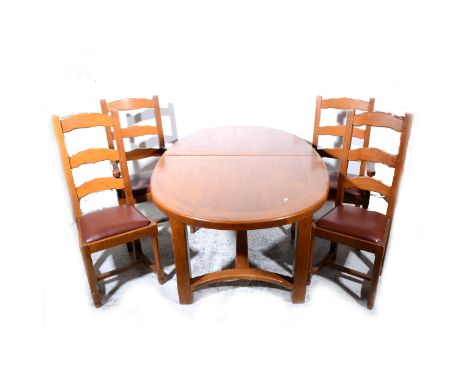 A contemporary oak dining room suite, comprising an extending dining table, with rounded ends, two additional leaves, square 