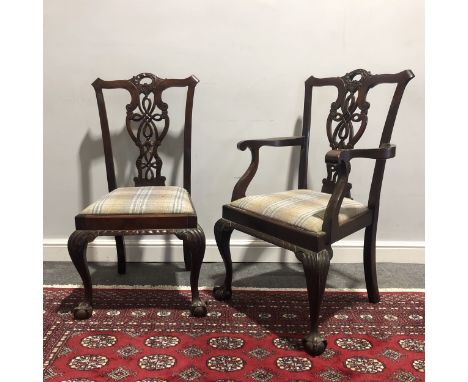 A set of six reproduction Chippendale inspired dining chairs, upholstered with tartan pattern seats, including two further el