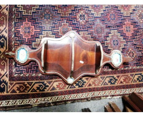 French walnut and ebonised wall shelf, gilt metal and porcelain mounts, 88cm.