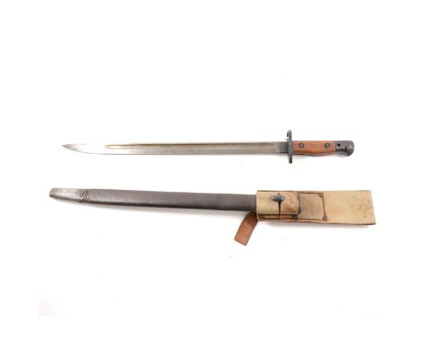 An English Wilkinson 1907 7 16 bayonet with Crown and GR cypher, two piece wooden grip in a leather scabbard and lighter leat