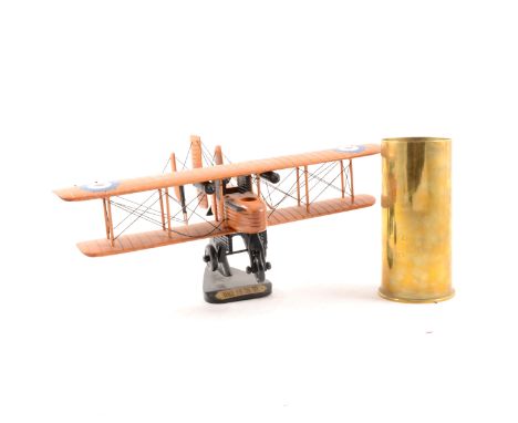 Brass aircraft engine starter cartridge No. 10 Mk.3 RLB83/7, pair of RAF napkin rings, wooden model bi-plane "Reach For The S