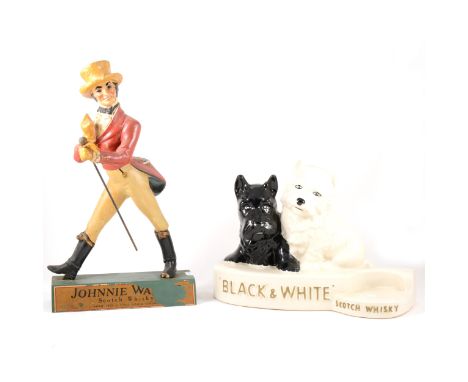 Reproduction candlestick telephone, a Johnny Walker bar advertising figure, and Black and White Whisky ceramic bar advertisin