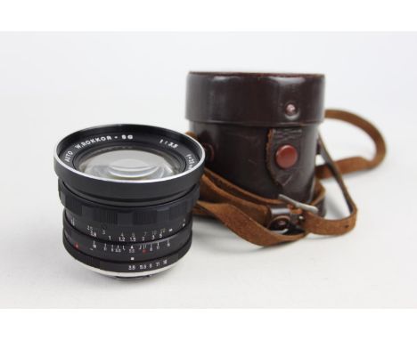 Minolta Auto W.Rokkor-SG 28mm F/3.5 Lens w/ Case  Lens is MECHANICALLY WORKING Aperture blades are responsive Glass has inter