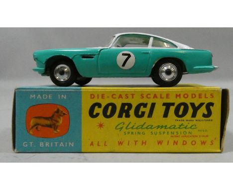 Corgi Toys 309 Aston Martin D.B.4 Competition Model, white/turquoise body, lemon interior, spun shaped wheel hubs, racing num