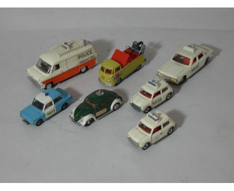 A collection of Dinky and Corgi police vehicles, together with a Corgi tow-truck. (7) 