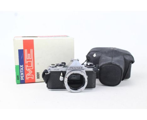 Pentax ME SLR Film Camera Body ONLY w/ Original Box  The camera is WORKING and in a good condition Winds and fires as should,