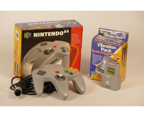 Boxed Nintendo 64 games console together with a boxed controller and a vibration pack and a selection of games including- Sup