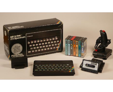 Boxed Spectrum Rubber Key 48K machine, power supply, TV lead,  tape player lead and two manual. Collection of thirteen games 