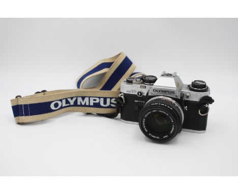 Olympus OM10 SLR Film Camera Olympus OM-System 50mm F/1.8 Lens  This set is MECHANICALLY WORKING Camera winds &amp; fires as 