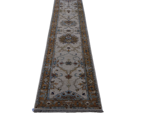 A 20th century Indian wool runner - 'Ivory and Rust' pattern, 74 x 302cm.