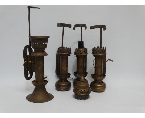 A 19th century continental brass railway carriage lamp - height 27cm, together with two similar and another (4). 