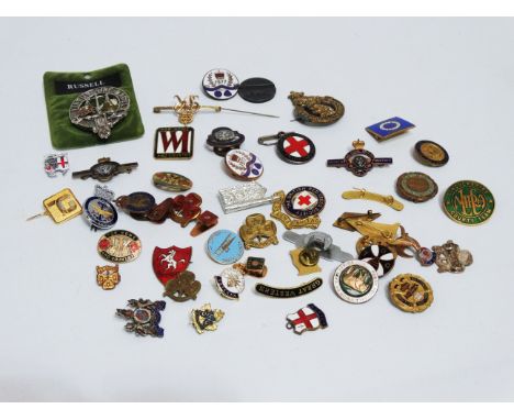 A quantity of enamel badges - including The Rugby Union of East Africa, The Civil Service Corps, The W.I., Junior Red Cross a